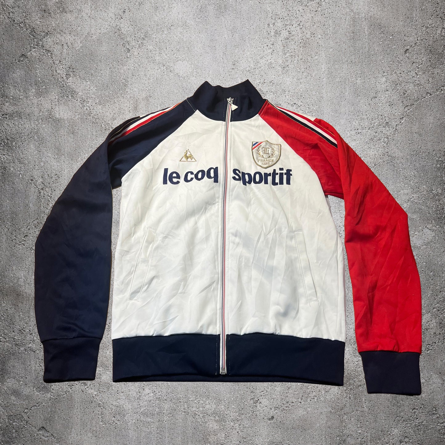 Veste sportive blanc, bleu et rouge - Le Coq Sportif France 1882