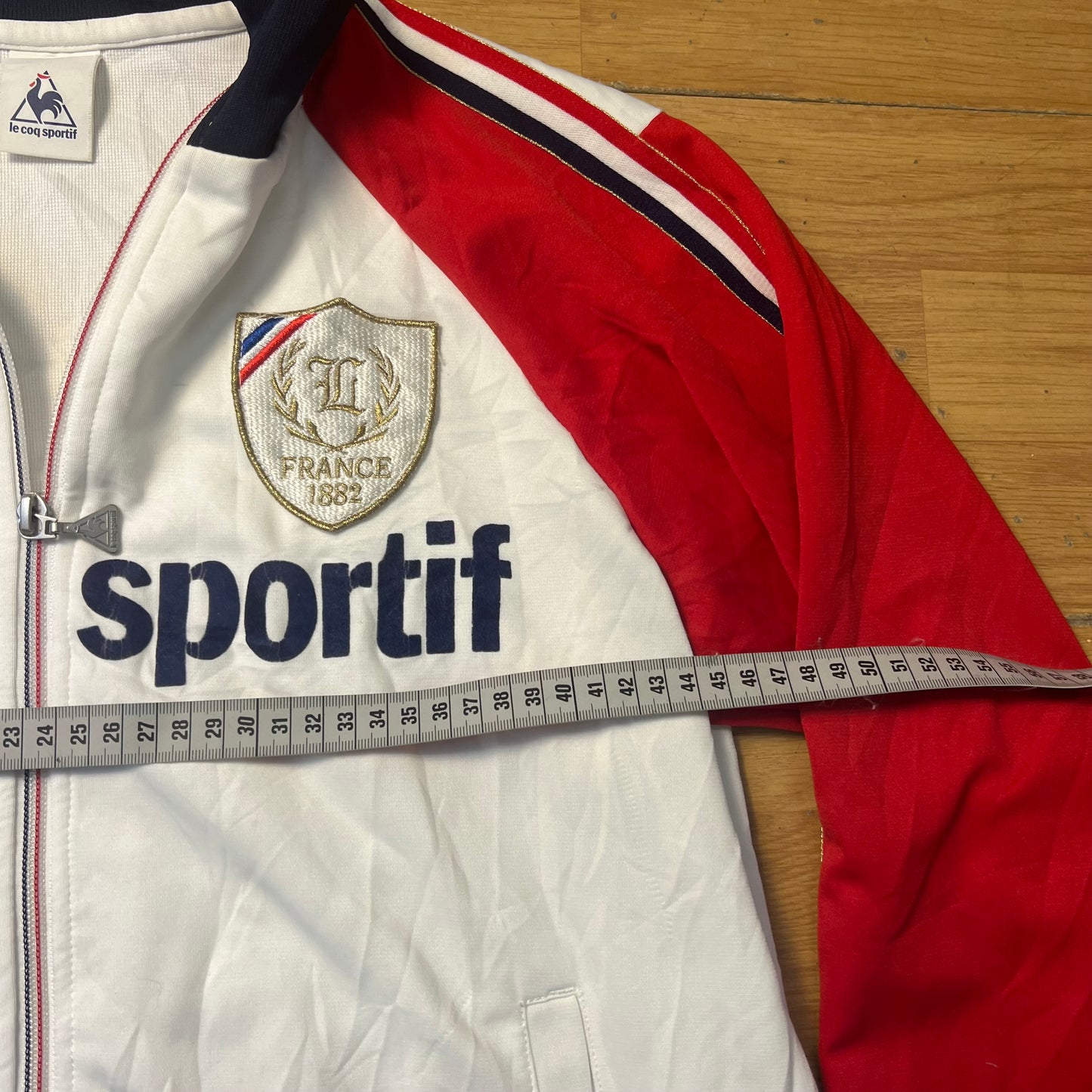 Veste sportive blanc, bleu et rouge - Le Coq Sportif France 1882