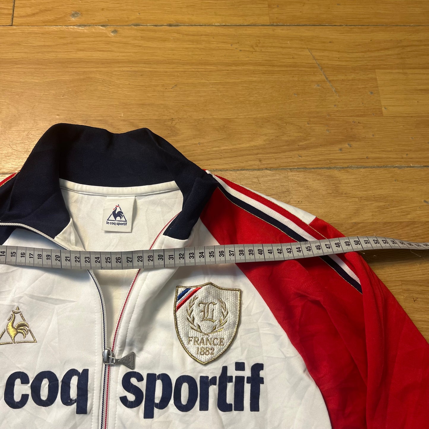 Veste sportive blanc, bleu et rouge - Le Coq Sportif France 1882