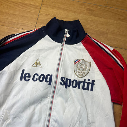 Veste sportive blanc, bleu et rouge - Le Coq Sportif France 1882